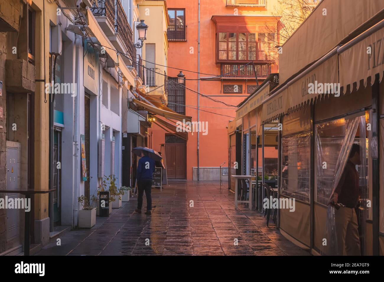 Granada, Spain - March 30 2018: Sun and rain at Plaza Bibarrambla in the colourful old town of Granada, Andalusia, Spain. Stock Photo