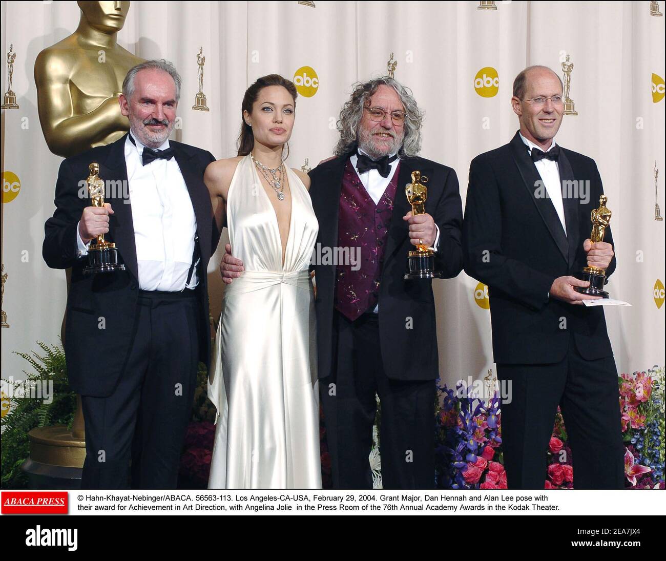 Grant Major, Dan Hennah and Alan Lee pose with their award for Achievement in Art Direction, with Angelina Jolie in the Press Room of the 76th Annual Academy Awards in the Kodak Theater, Los Angeles, CA. February 29, 2004 (Pictured : Grant Major, Dan Hennah, Alan Lee, Angelina Jolie) Photo by Hahn-Khayat-Nebinger/ABACA Stock Photo