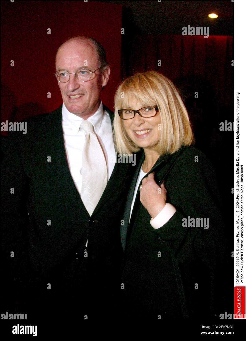 ABACA. 56635-4. Cannes-France, March 1, 2004.French actress Mireille Darc  and her boyfriend attend the opening of the new Lucien Barriere casino  place located at the Noga Hilton hotel Stock Photo - Alamy