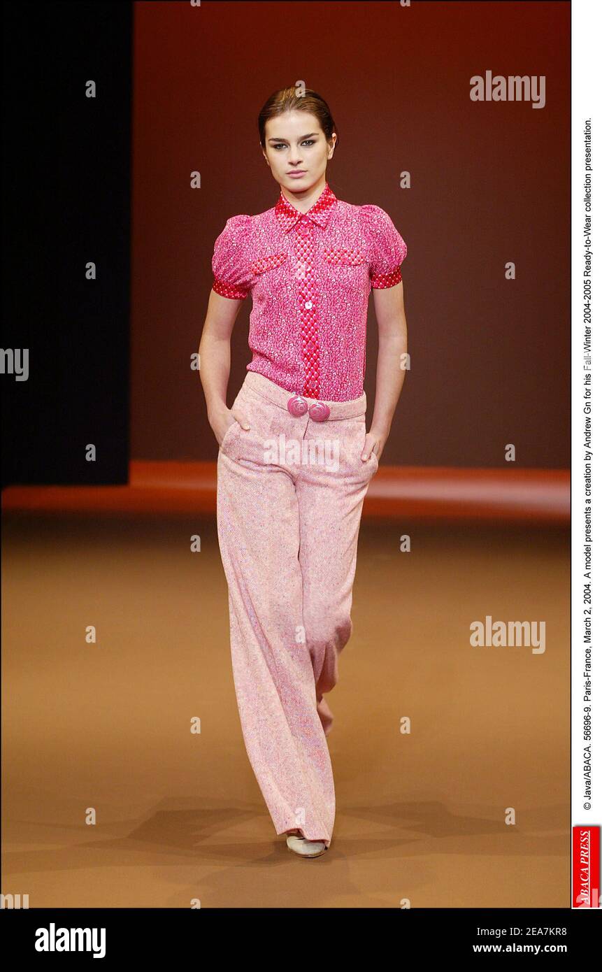 © Java/ABACA. 56696-9. Paris-France, March 2, 2004. A model presents a creation by Andrew Gn for his Fall-Winter 2004-2005 Ready-to-Wear collection presentation. Stock Photo