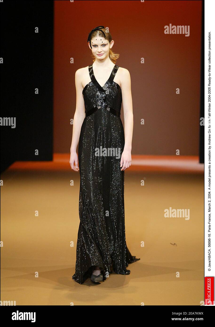 © Java/ABACA. 56696-16. Paris-France, March 2, 2004. A model presents a creation by Andrew Gn for his Fall-Winter 2004-2005 Ready-to-Wear collection presentation. Stock Photo