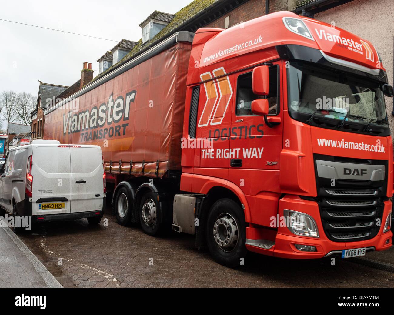 Heavy good vehicle (HGV) in congestion on a narrow high street in the UK Stock Photo