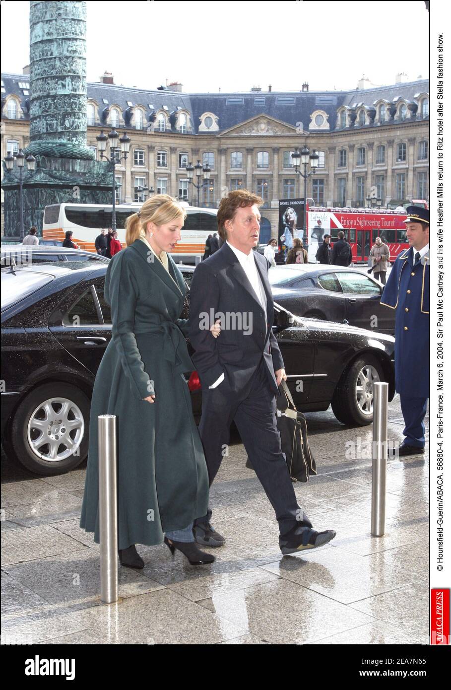 © Hounsfield-Guerin/ABACA. 56860-4. Paris-France, March 6, 2004. Sir Paul McCartney and his wife Heather Mills return to the Ritz hotel after Stella McCartney's fashion show. Stock Photo