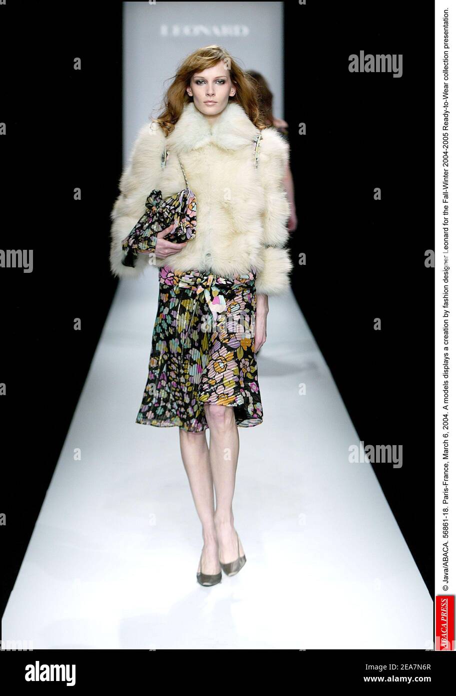 © Java/ABACA. 56861. Paris-France, March 6, 2004. A model displays a creation by fashion designer Leonard for the Fall-Winter 2004-2005 Ready-to-Wear collection presentation. Stock Photo
