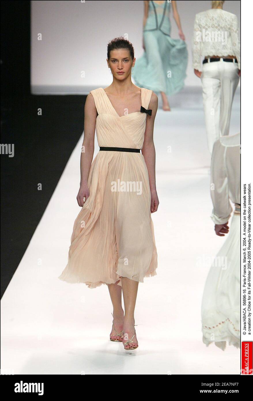 © Java/ABACA. 56896-16. Paris-France, March 6, 2004. A model on the catwalk wears a creation by Chloe for its Fall-Winter 2004-2005 Ready-to-Wear collection presentation. Stock Photo