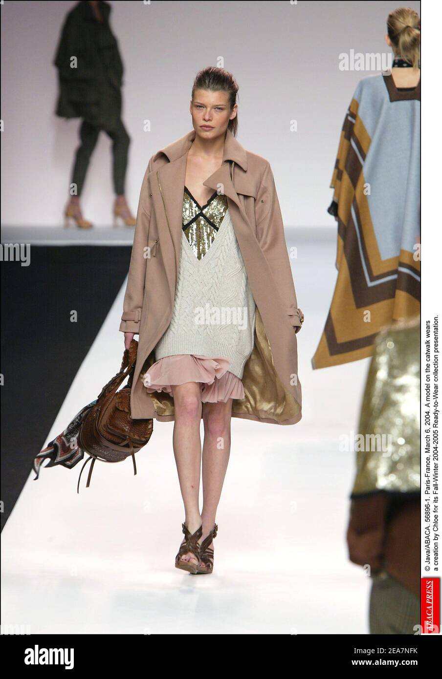 © Java/ABACA. 56896-1. Paris-France, March 6, 2004. A model on the catwalk wears a creation by Chloe for its Fall-Winter 2004-2005 Ready-to-Wear collection presentation. Stock Photo