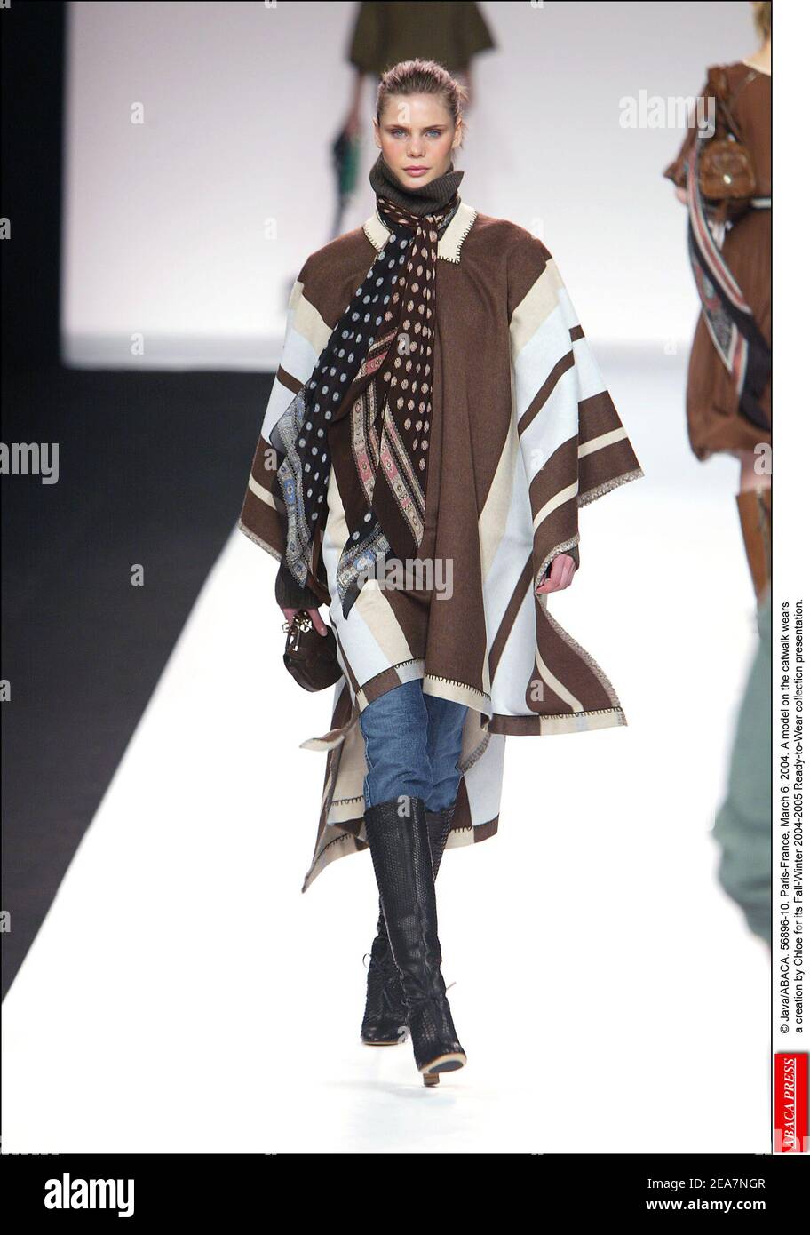 © Java/ABACA. 56896-10. Paris-France, March 6, 2004. A model on the catwalk wears a creation by Chloe for its Fall-Winter 2004-2005 Ready-to-Wear collection presentation. Stock Photo