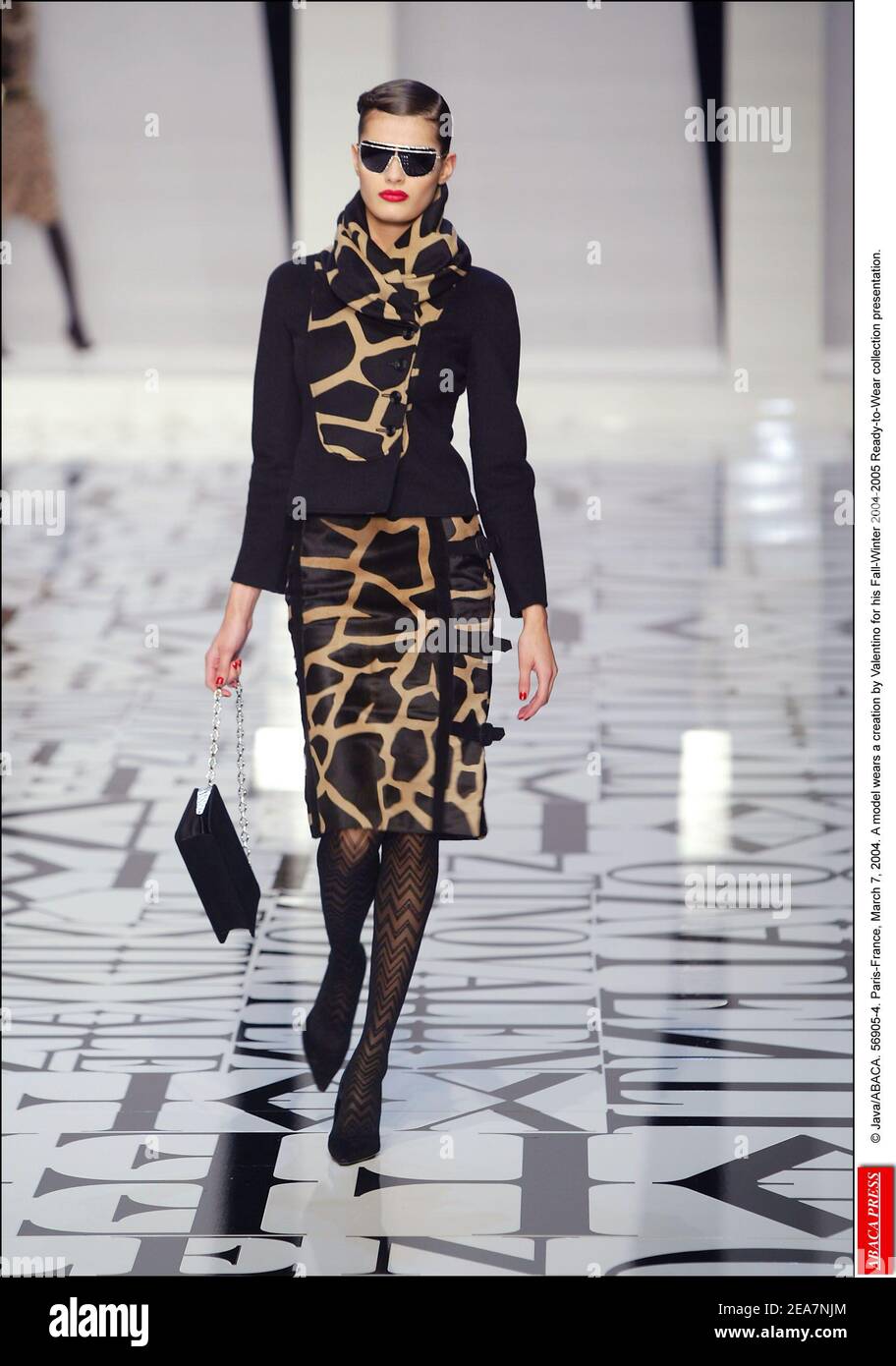 © Java/ABACA. 56905-4. Paris-France, March 7, 2004. A model wears a creation by Valentino for his Fall-Winter 2004-2005 Ready-to-Wear collection presentation. Stock Photo