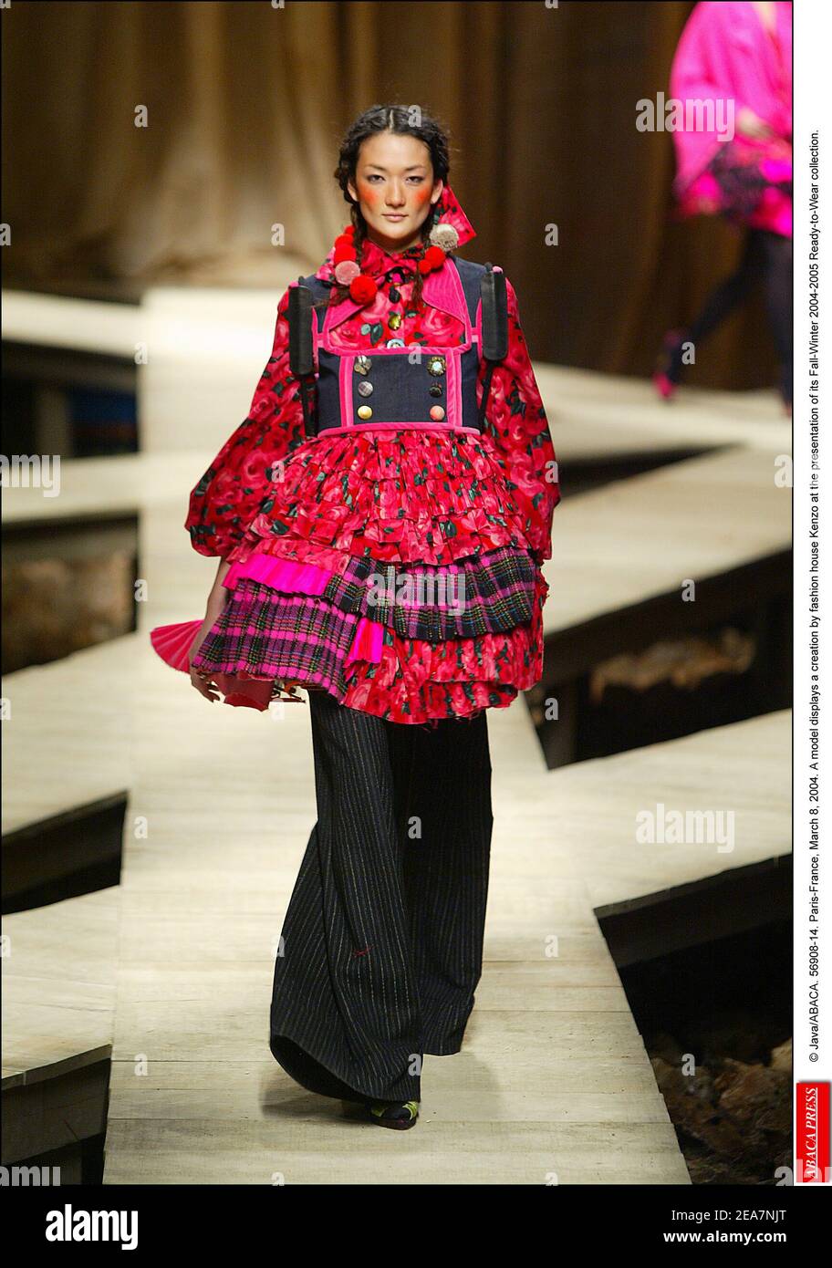 © Java/ABACA. 56908-14. Paris-France, March 8, 2004. A model displays a creation by fashion house Kenzo at the presentation of its Fall-Winter 2004-2005 Ready-to-Wear collection. Stock Photo