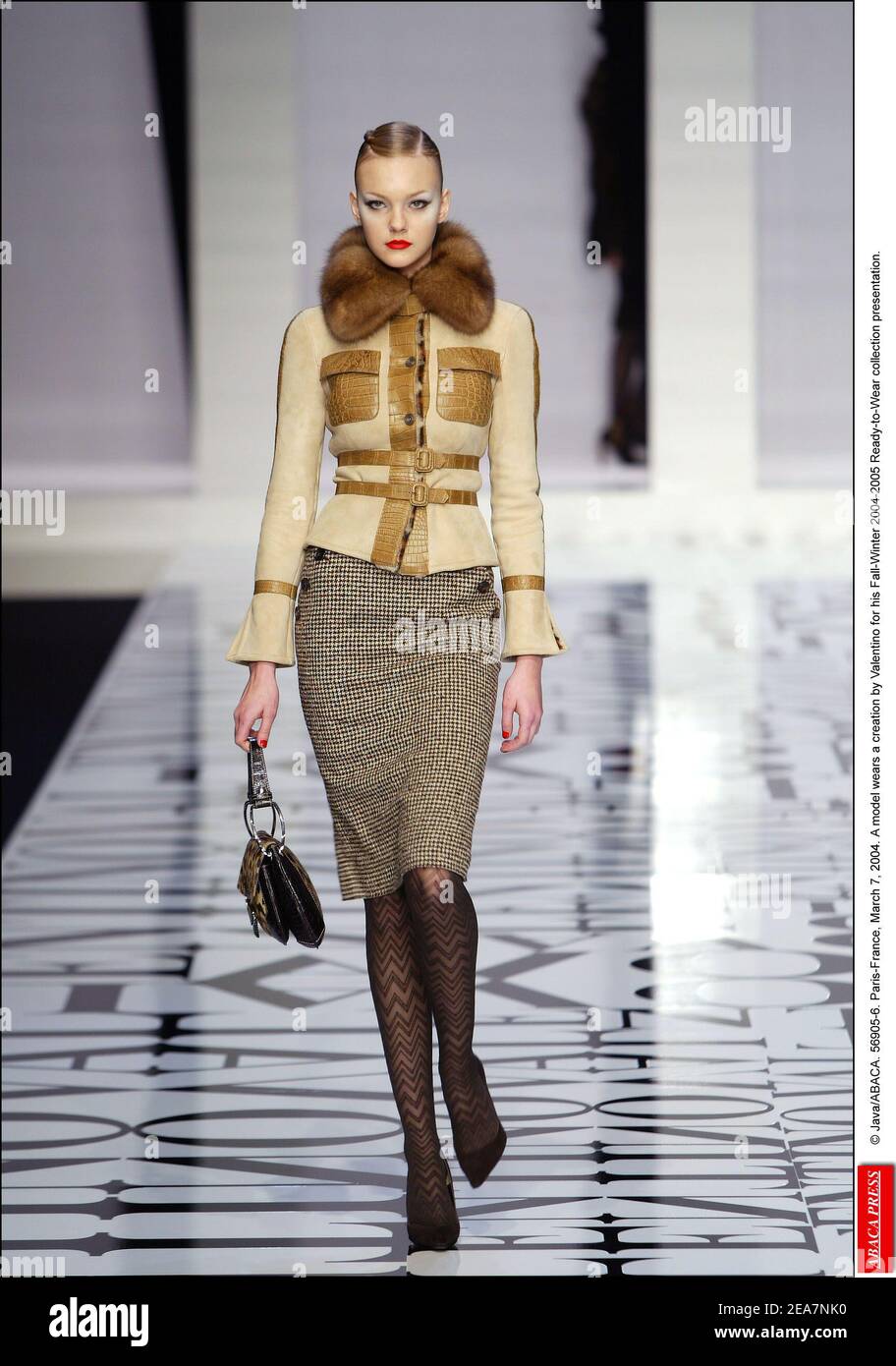 © Java/ABACA. 56905-6. Paris-France, March 7, 2004. A model wears a creation by Valentino for his Fall-Winter 2004-2005 Ready-to-Wear collection presentation. Stock Photo