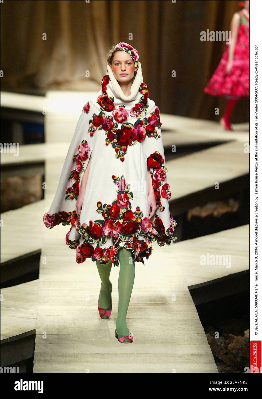 © Java/ABACA. 56908-8. Paris-France, March 8, 2004. A model displays a creation by fashion house Kenzo at the presentation of its Fall-Winter 2004-2005 Ready-to-Wear collection. Stock Photo