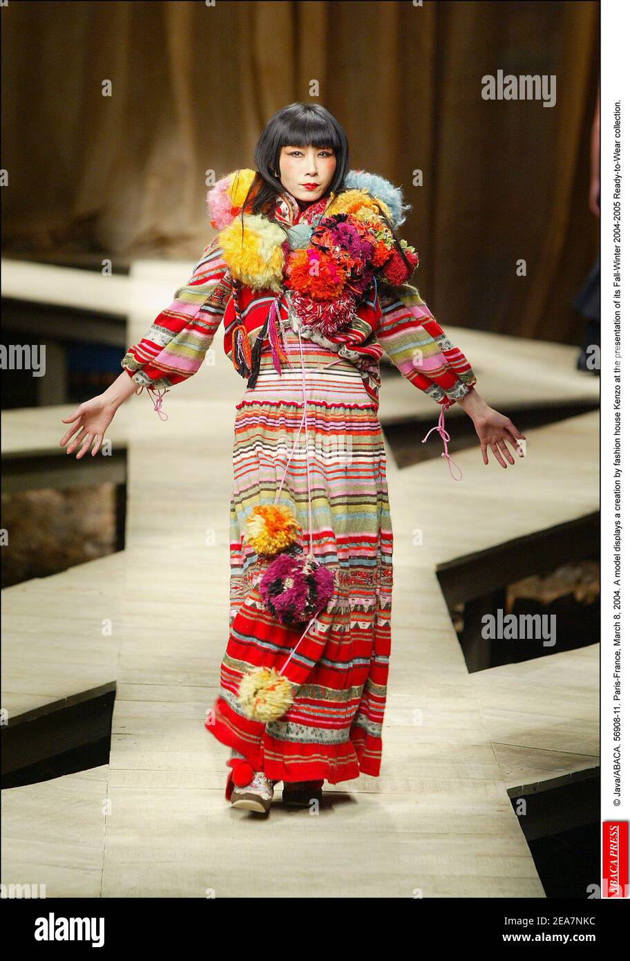© Java/ABACA. 56908-11. Paris-France, March 8, 2004. A model displays a creation by fashion house Kenzo at the presentation of its Fall-Winter 2004-2005 Ready-to-Wear collection. Stock Photo