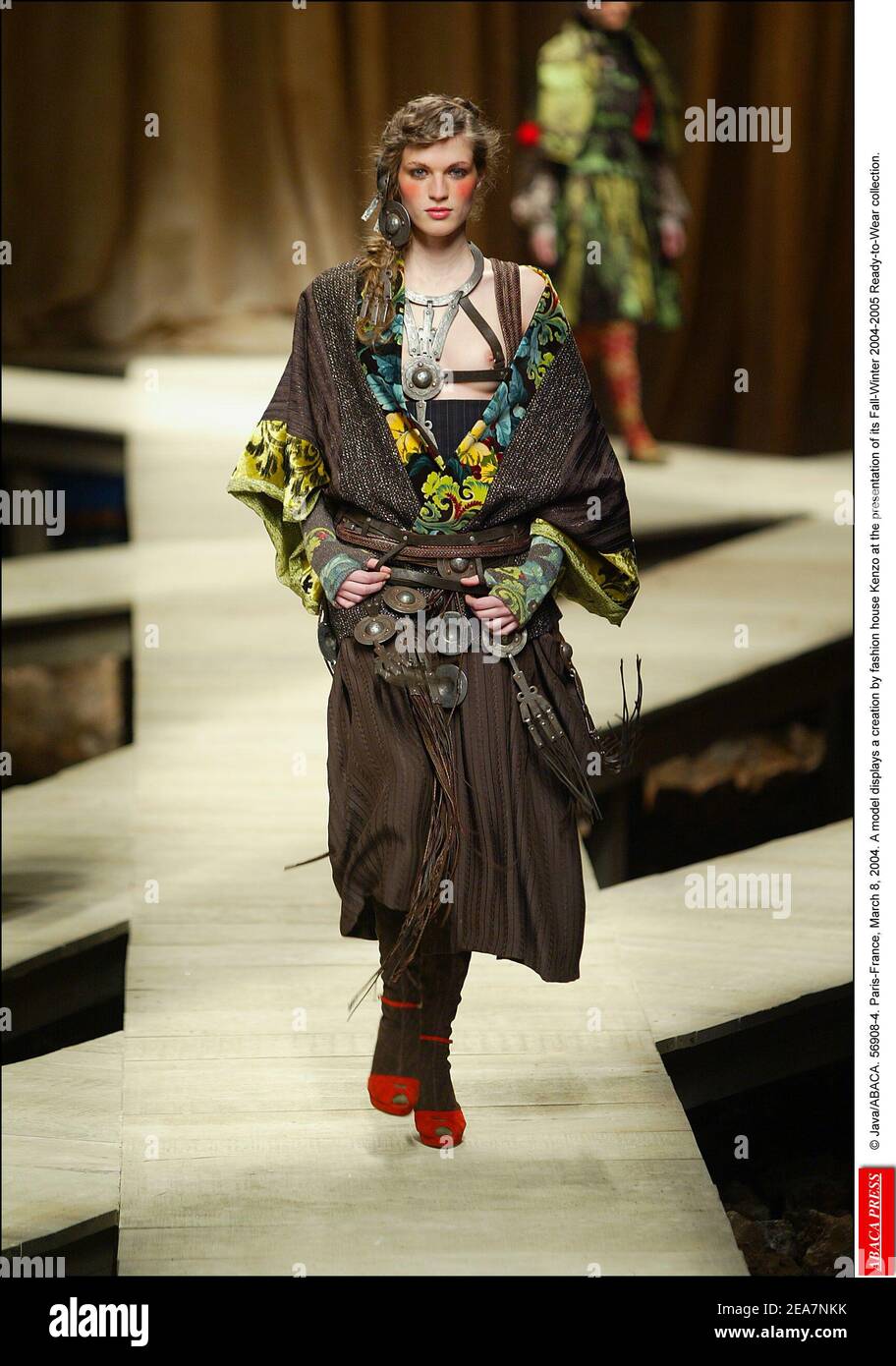 © Java/ABACA. 56908-4. Paris-France, March 8, 2004. A model displays a creation by fashion house Kenzo at the presentation of its Fall-Winter 2004-2005 Ready-to-Wear collection. Stock Photo