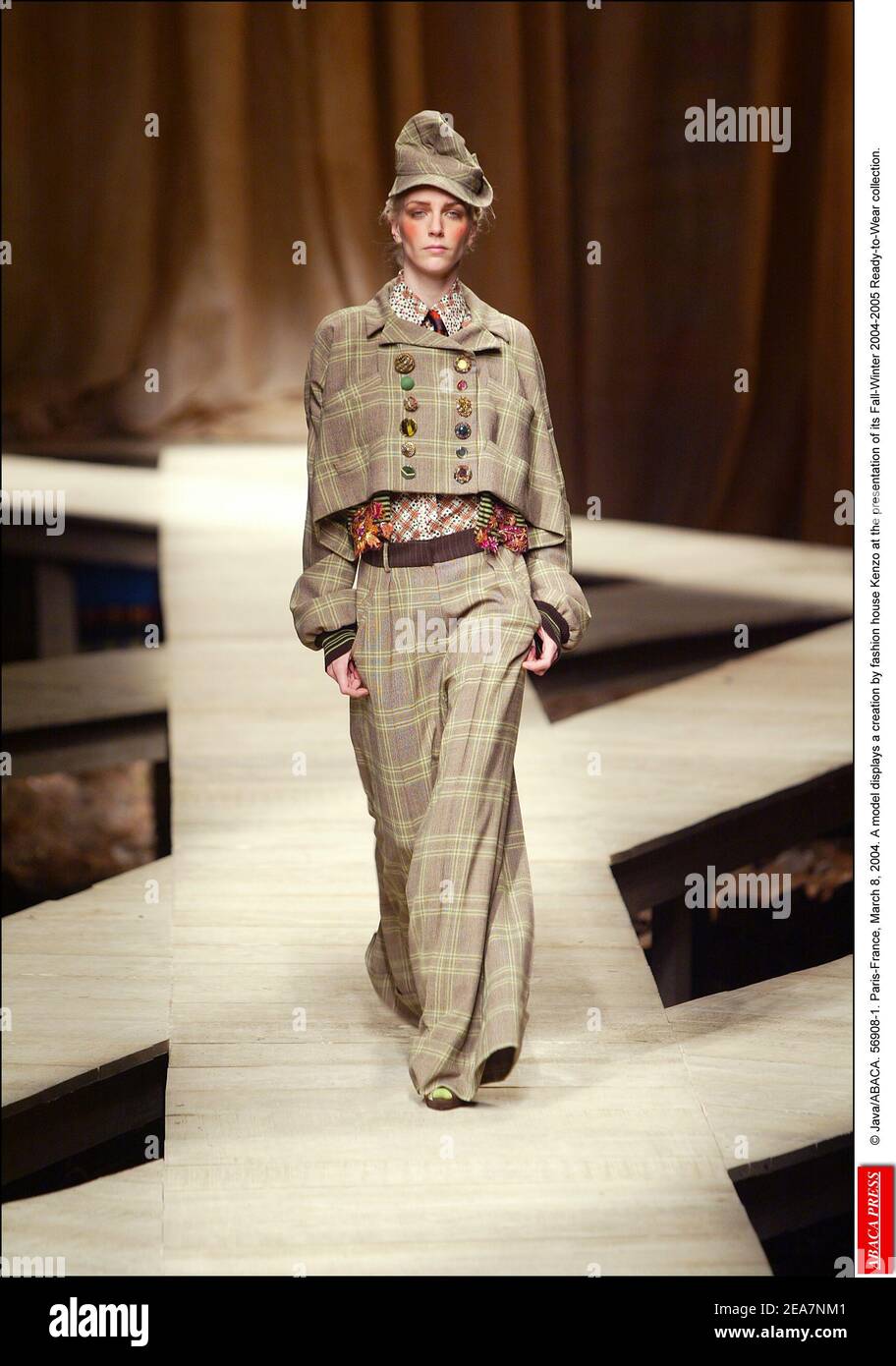 © Java/ABACA. 56908-1. Paris-France, March 8, 2004. A model displays a creation by fashion house Kenzo at the presentation of its Fall-Winter 2004-2005 Ready-to-Wear collection. Stock Photo