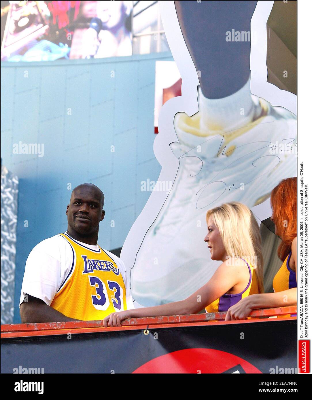 © Jeff Tran/ABACA. 56916-6. Universal City-CA-USA, March 06, 2004. In celebration of Shaquille O'Neal's 32nd birthday and to mark the grand opening of Team LA superstore on Universal CityWalk, Shaquille unveils a 40 feet tall neon sign in his likeness sporting his famous number 34 Lakers Jersey. However, Shaquille attends the event wearing a Lakers Jersey number 33 which was once worn by a retired Lakers player, Kareem Abdul-Jabar. Stock Photo