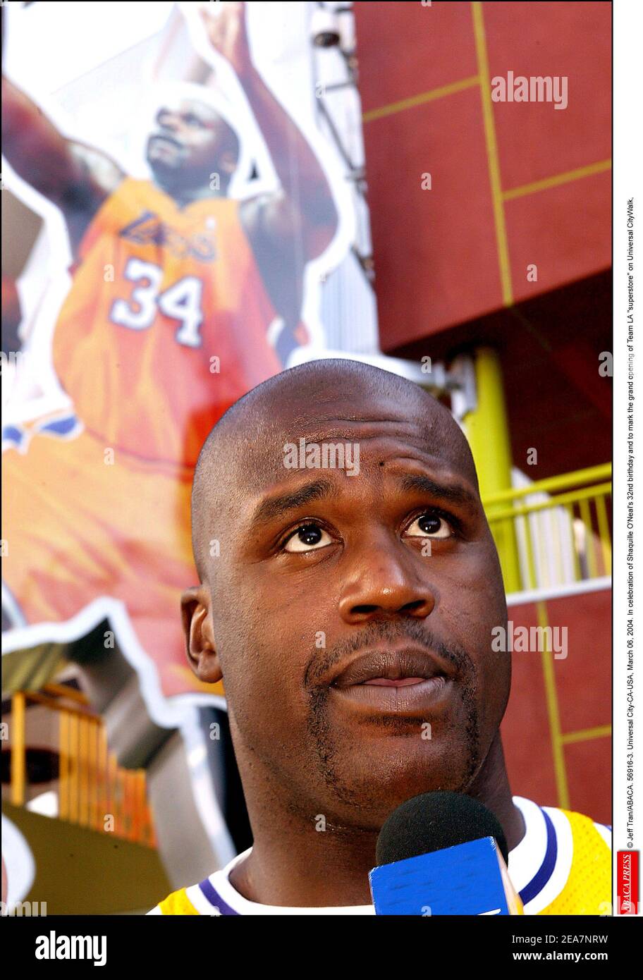 © Jeff Tran/ABACA. 56916-3. Universal City-CA-USA, March 06, 2004. In celebration of Shaquille O'Neal's 32nd birthday and to mark the grand opening of Team LA superstore on Universal CityWalk, Shaquille unveils a 40 feet tall neon sign in his likeness sporting his famous number 34 Lakers Jersey. However, Shaquille attends the event wearing a Lakers Jersey number 33 which was once worn by a retired Lakers player, Kareem Abdul-Jabar. Stock Photo