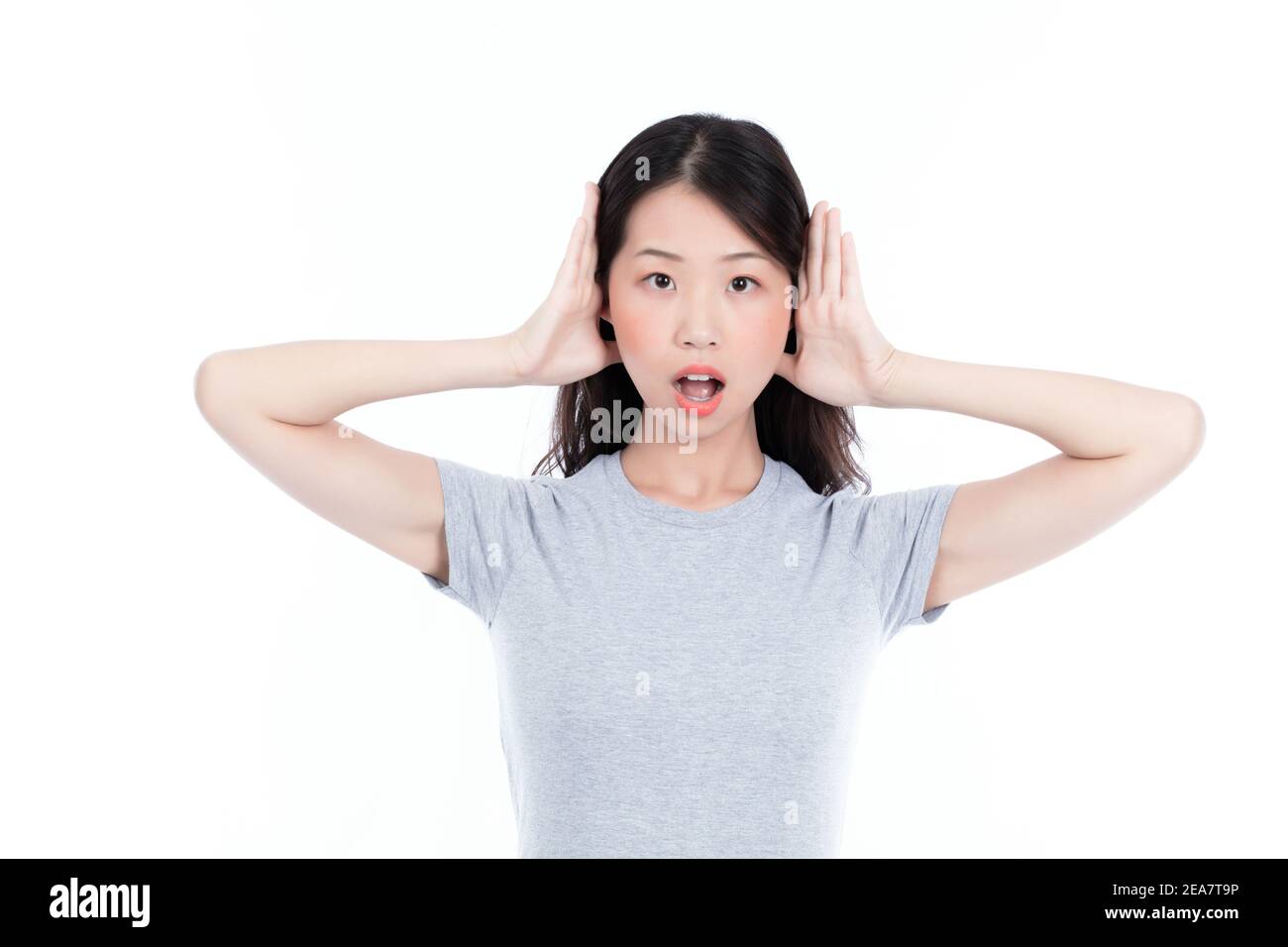 A young woman plugged her ears with her fingers Stock Photo Alamy