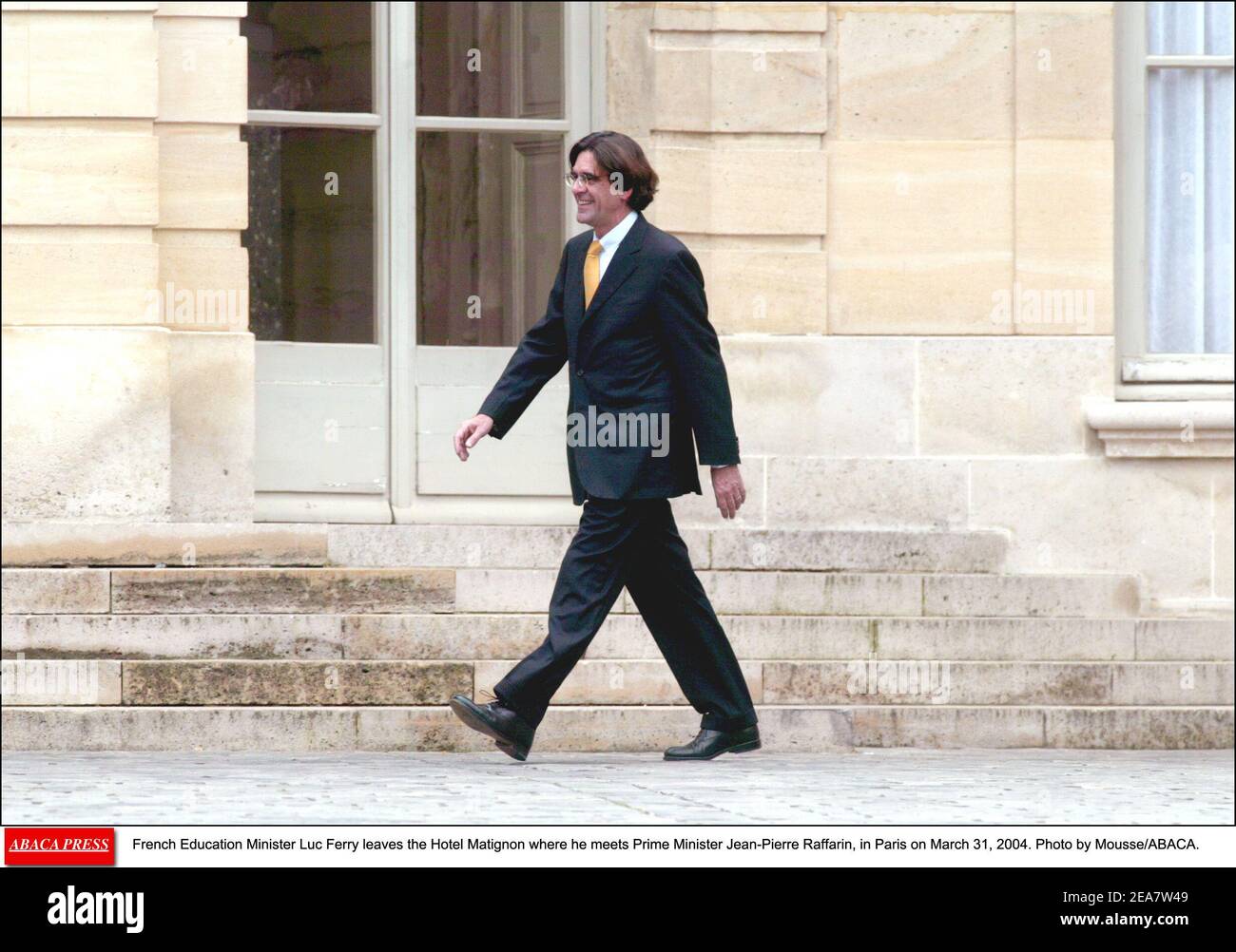 French Education Minister Luc Ferry leaves the Hotel Matignon where he meets Prime Minister Jean-Pierre Raffarin, in Paris on March 31, 2004. Photo by Mousse/ABACA. Stock Photo
