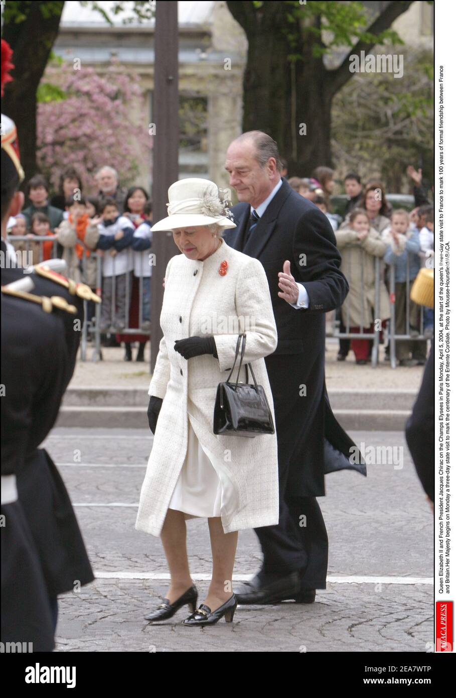 Britian's Queen Elizabeth II and French President Jacques Chirac on the Champs Elysees in Paris Monday, April 5, 2004, at the start of the queen's three-day state visit to France to mark 100 years of formal friendship between France and Britain.Her Majesty begins on Monday a three-day state visit to mark the centenary of the Entente Cordiale. Photo by Mousse-Hounsfield/ABACA. Stock Photo