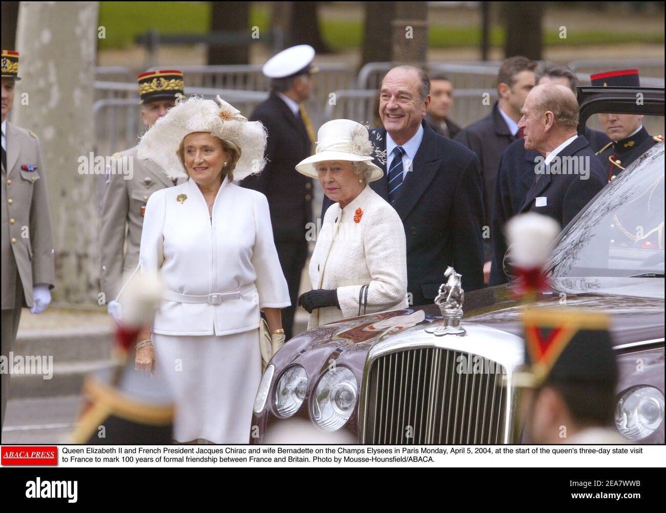 Britian's Queen Elizabeth II and French President Jacques Chirac and his wife Bernadette on the Champs Elysees in Paris Monday, April 5, 2004, at the start of the queen's three-day state visit to France to mark 100 years of formal friendship between France and Britain. Photo by Mousse-Hounsfield/ABACA. Stock Photo