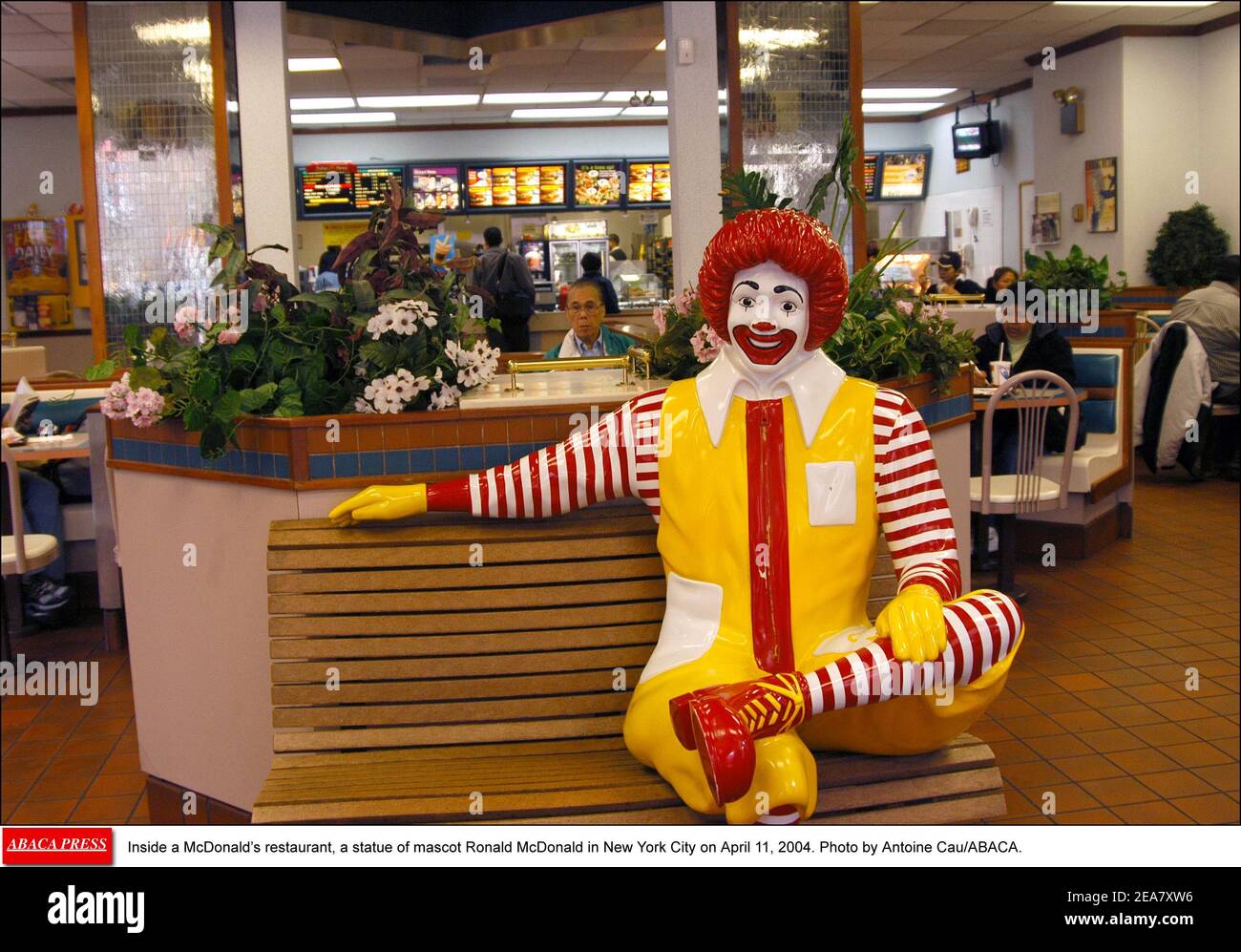 Inside a McDonald's restaurant, a statue of mascot Ronald McDonald in New York City on April 11, 2004. Photo by Antoine Cau/ABACA. Stock Photo
