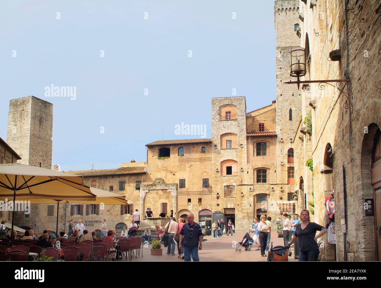 San Gimignano, Italy - September 15th 2009: Unidentified tourists on the market square of the medieval village in Tuscany, a Unesco World Heritage sit Stock Photo