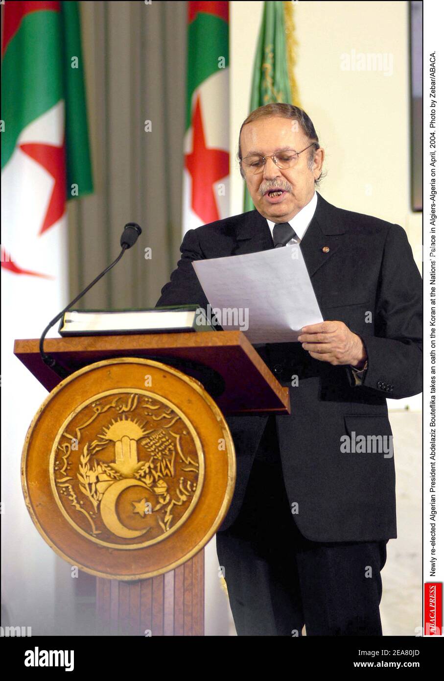 Newly re-elected Algerian President Abdelaziz Bouteflika takes an oath on the Koran at the Nations' Palace in Algiers-Algeria on April, 2004. Photo by Zebar/ABACA. Stock Photo