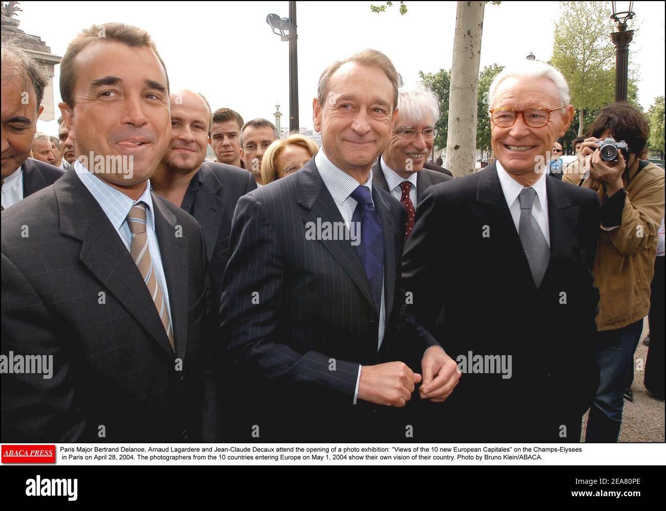 Paris Major Bertrand Delanoe, Arnaud Lagardere and Jean-Claude Decaux  attend the opening of a photo exhibition: Views of the 10 new European  Capitales on the Champs-Elysees in Paris on April 28, 2004.