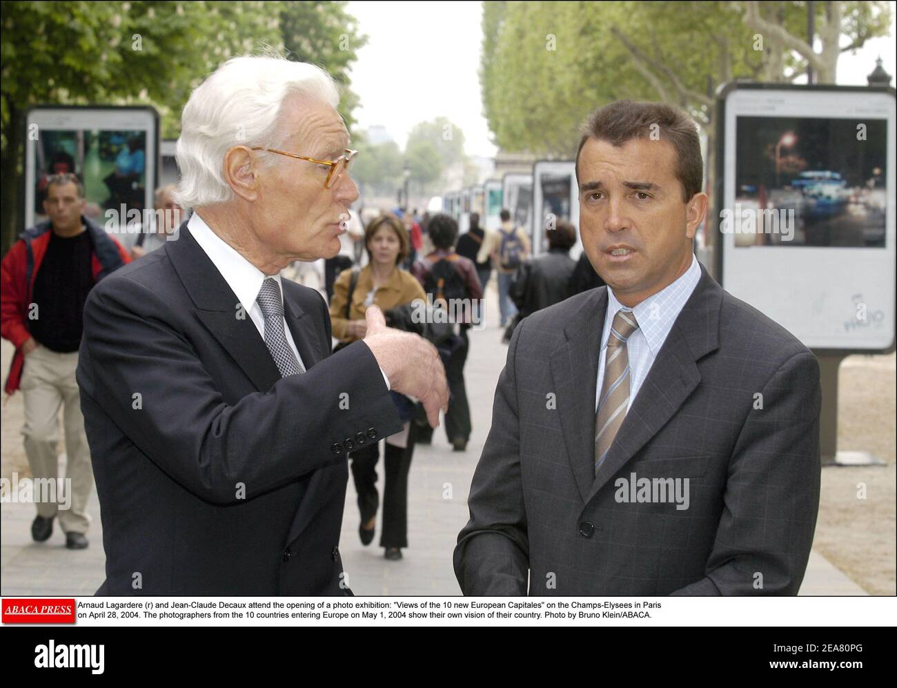 Arnaud Lagardere (r) and Jean-Claude Decaux attend the opening of a photo  exhibition: Views of the 10 new European Capitales on the Champs-Elysees in  Paris on April 28, 2004. The photographers from