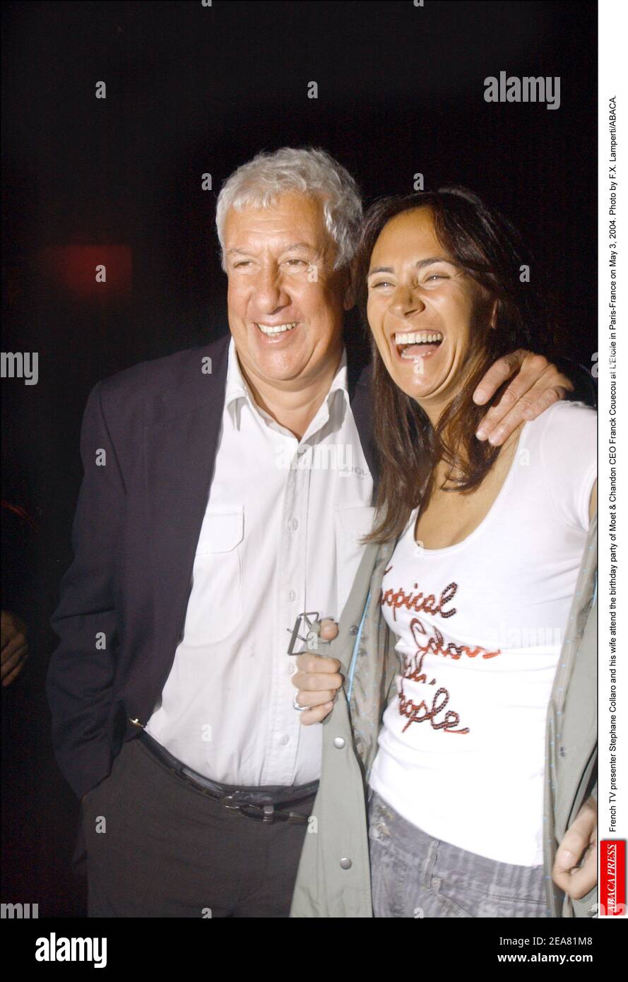 French TV presenter Stephane Collaro and his wife attend the birthday party of Moet & Chandon CEO Franck Couecou at L'Etoile in Paris-France on May 3, 2004. Photo by F.X. Lamperti/ABACA. Stock Photo