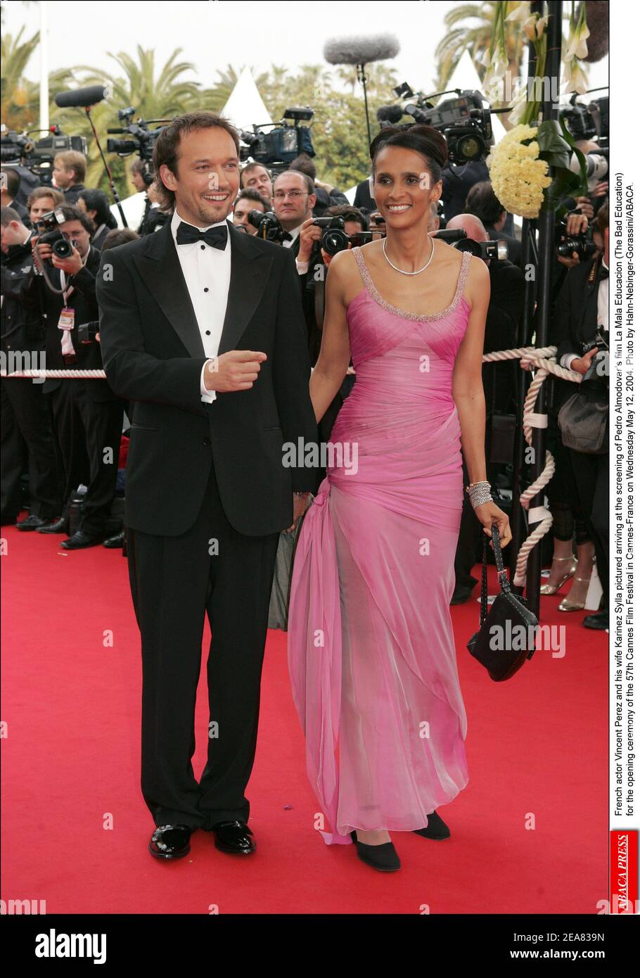 Swiss actor Vincent Perez and his wife Karinez Sylla pictured arriving at the screening of Pedro Almodovar's film La Mala Educacion (The Bad Education) for the opening ceremony of the 57th Cannes Film Festival in Cannes-France on Wednesday May 12, 2004. Photo by Hahn-Nebinger-Gorassini/ABACA. Stock Photo