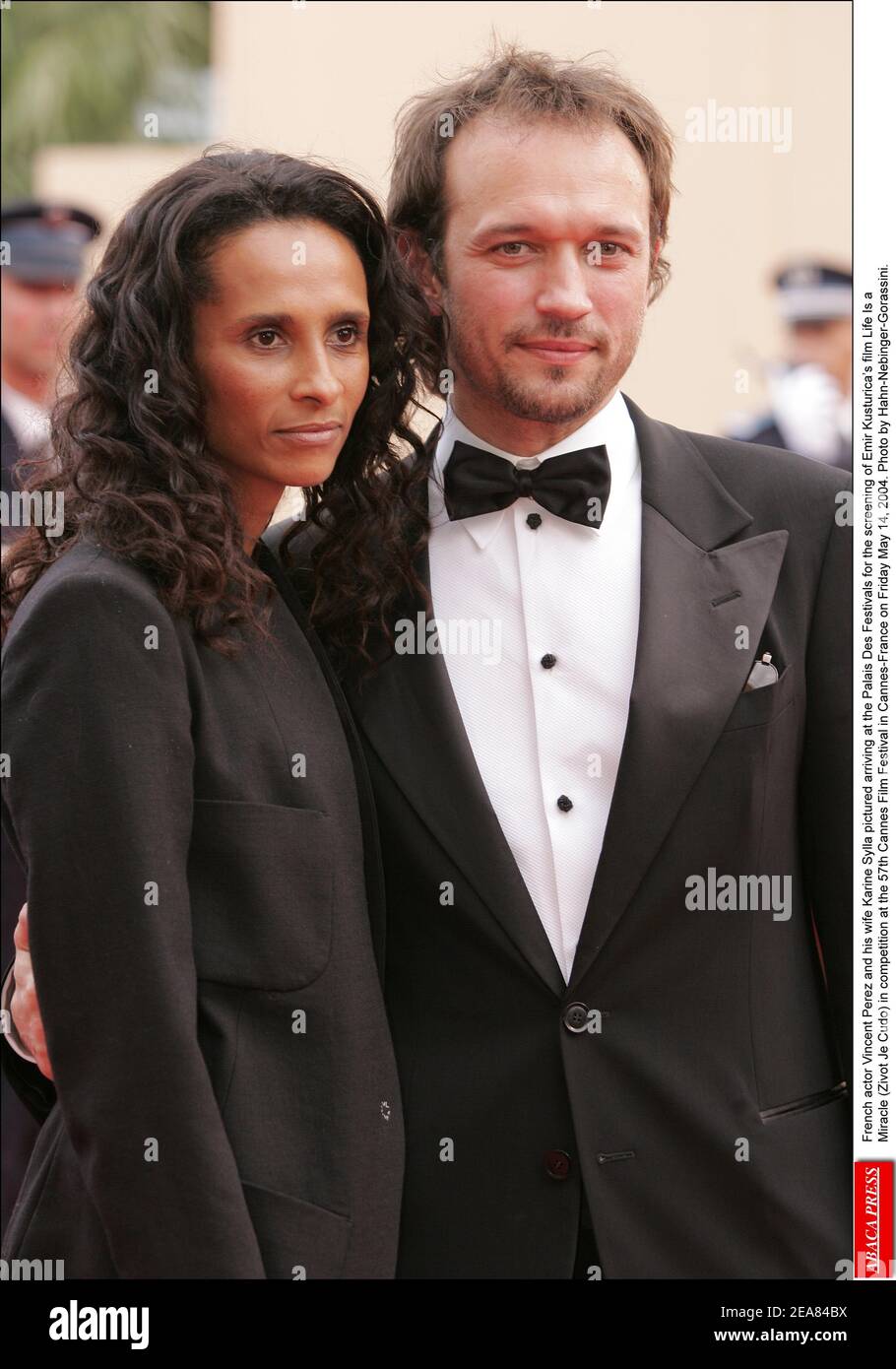 Swiss actor Vincent Perez and his wife Karine Sylla pictured arriving at the Palais Des Festivals for the screening of Emir Kusturica's film Life Is a Miracle (Zivot Je Cudo) in competition at the 57th Cannes Film Festival in Cannes-France on Friday May 14, 2004. Photo by Hahn-Nebinger-Gorassini. Stock Photo