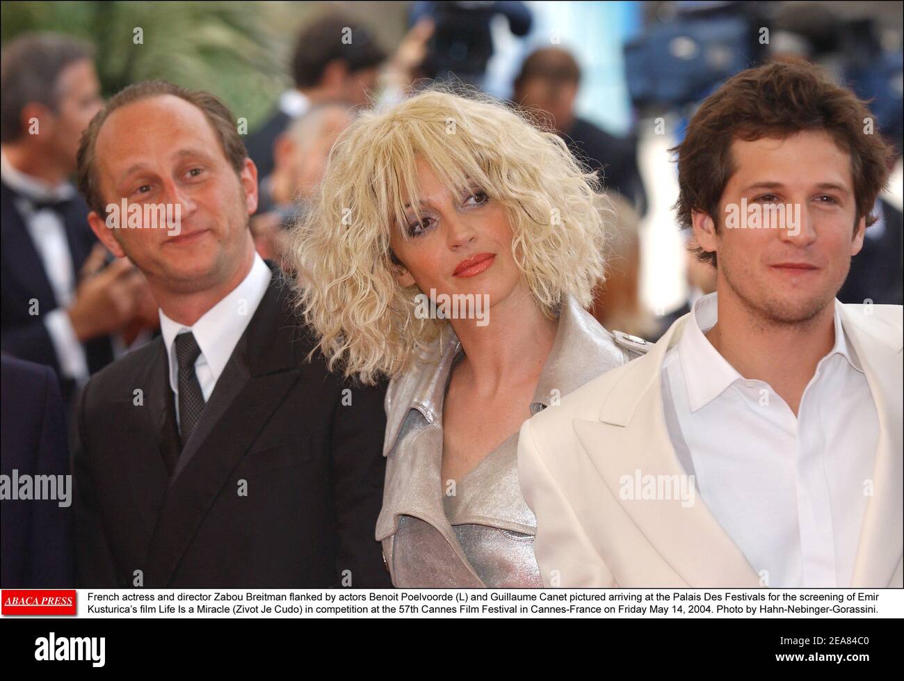 French actress and director Zabou Breitman flanked by actors Benoit Poelvoorde (L) and Guillaume Canet pictured arriving at the Palais Des Festivals for the screening of Emir Kusturica's film Life Is a Miracle (Zivot Je Cudo) in competition at the 57th Cannes Film Festival in Cannes-France on Friday May 14, 2004. Photo by Hahn-Nebinger-Gorassini. Stock Photo