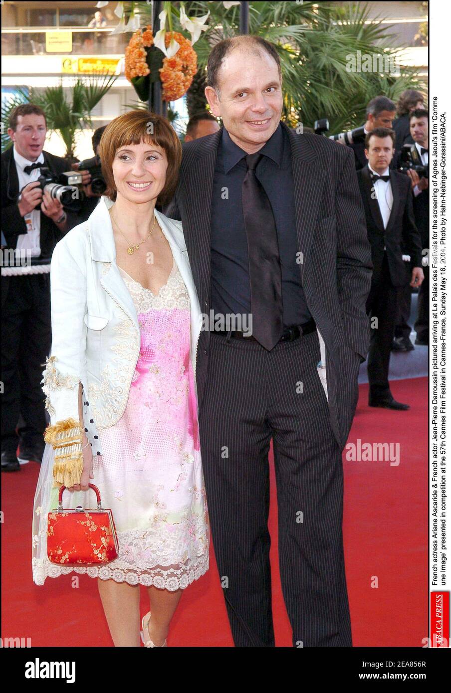 French actress Ariane Ascaride & French actor Jean-Pierre Darroussin pictured arriving at Le Palais des Festivals for the screening of Agnes Jaoui's film ïComme une Image' presented in competition at the 57th Cannes Film Festival in Cannes-France, Sunday May 16, 2004. Photo by Hahn-Nebinger-Gorassini/ABACA. Stock Photo