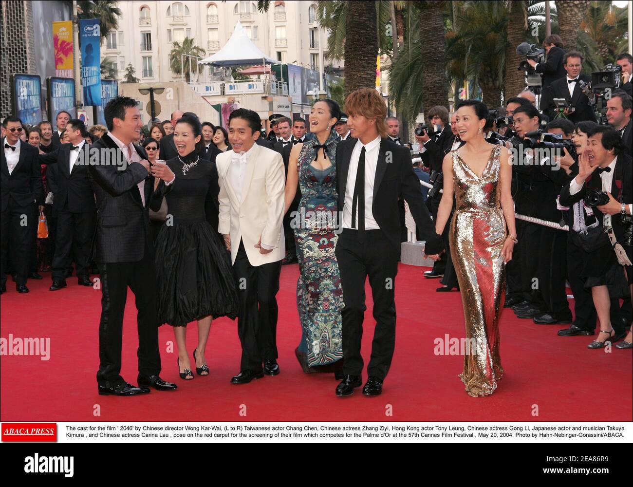The cast for the film ' 2046' by Chinese director Wong Kar-Wai, (L to R) Taiwanese actor Chang Chen, Chinese actress Zhang Ziyi, Hong Kong actor Tony Leung, Chinese actress Gong Li, Japanese actor and musician Takuya Kimura , and Chinese actress Carina Lau , pose on the red carpet for the screening of their film which competes for the Palme d'Or at the 57th Cannes Film Festival , May 20, 2004. Photo by Hahn-Nebinger-Gorassini/ABACA. Stock Photo