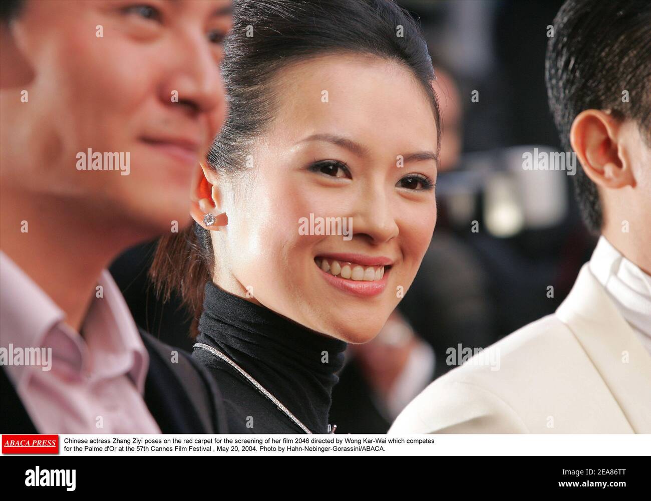 Chinese actress Zhang Ziyi poses on the red carpet for the screening of her film 2046 directed by Wong Kar-Wai which competes for the Palme d'Or at the 57th Cannes Film Festival , May 20, 2004. Photo by Hahn-Nebinger-Gorassini/ABACA. Stock Photo