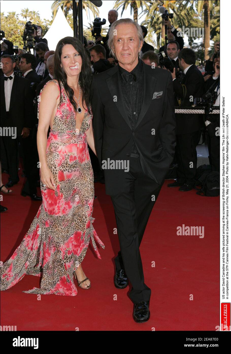 US actor David Carradine and his wife Annie Bierman pictured arriving at the screening of British director Stephen Hopkins' film 'The Life and Death of Peter Sellers' in competition at the 57th Cannes Film Festival in Cannes-France on Friday, May 21, 2004. Photo by Hahn-Nebinger-Gorassini/ABACA. Stock Photo