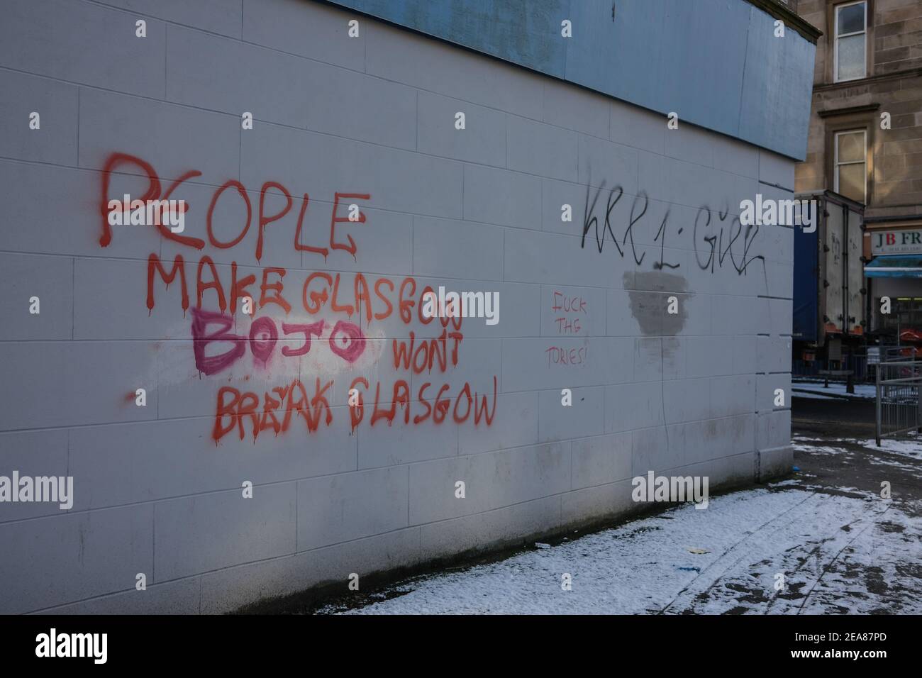 Glasgow, UK, on 8 February 2021. Political graffiti decrying British Prime Minister Boris Johnston on a wall in Govanhill district of the city. The wall is regularly daubed with political slogans and statements, and this same statement previously read '(Nicola) Sturgeon won't break Glasgow' as opposed to the current 'BO(ris) JO(hnson) won't break Glasgow'. Photo credit: Jeremy Sutton-Hibbert/Alamy Live News Stock Photo