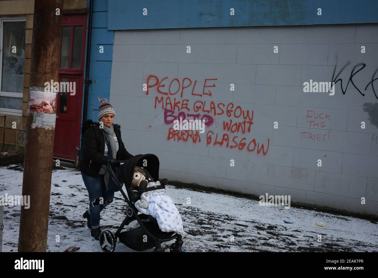 Glasgow, UK, on 8 February 2021. Political graffiti decrying British Prime Minister Boris Johnston on a wall in Govanhill district of the city. The wall is regularly daubed with political slogans and statements, and this same statement previously read '(Nicola) Sturgeon won't break Glasgow' as opposed to the current 'BO(ris) JO(hnson) won't break Glasgow'. Photo credit: Jeremy Sutton-Hibbert/Alamy Live News Stock Photo