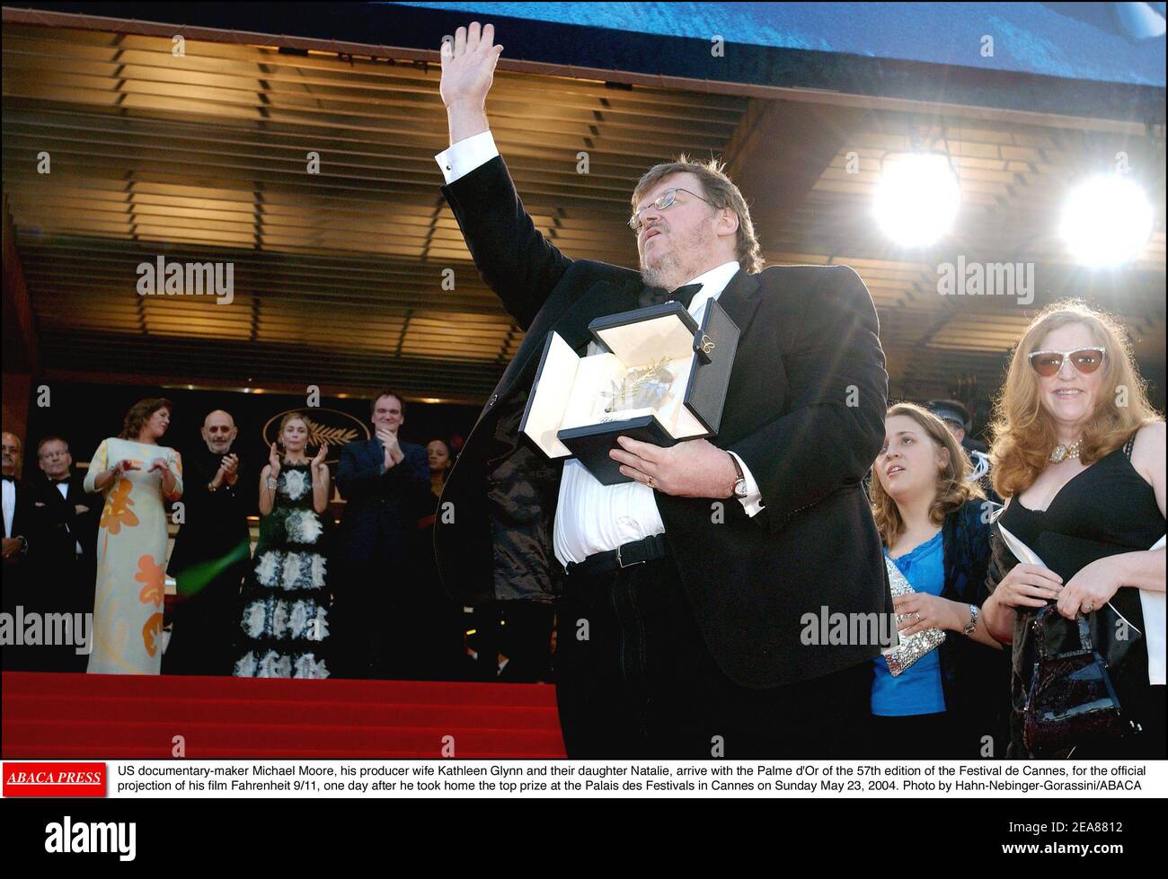 US documentary-maker Michael Moore, his producer wife Kathleen Glynn and  their daughter Natalie, arrive with the Palme d'Or of the 57th edition of  the Festival de Cannes, for the official projection of, image size:1300x979