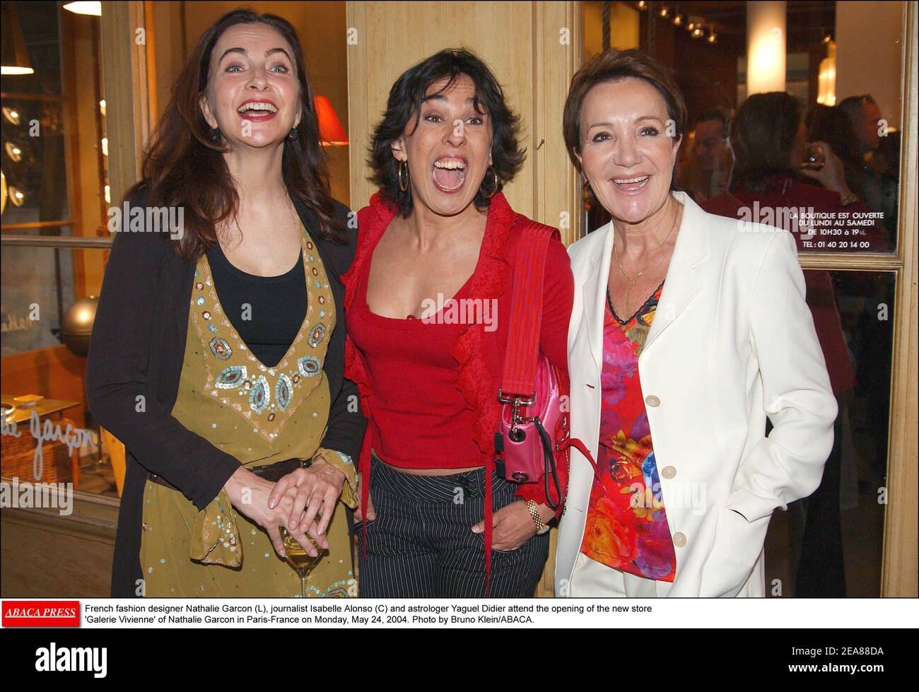 French fashion designer Nathalie Garcon (L), journalist Isabelle Alonso (C) and astrologer Yaguel Didier attend the opening of the new store 'Galerie Vivienne' of Nathalie Garcon in Paris-France on Monday, May 24, 2004. Photo by Bruno Klein/ABACA. Stock Photo