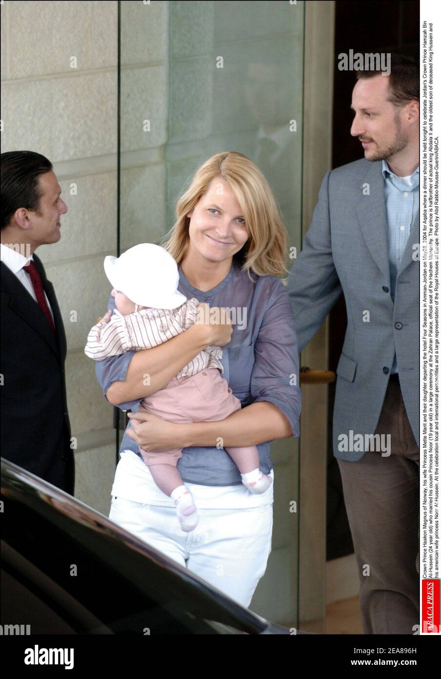 Crown Prince Haakon Magnus of Norway, his wife Princess Mette-Marit and their daughter departing the hotel Four Seasons in Amman-Jordan on May28, 2004 for Aqaba where a dinner should be held tonight to celebrate Jordan's Crown Prince Hamzah Bin Al-Hussein (24 year old) who married his cousin Princess Noor (19 year old) in a large ceremony at the Zahran Palace, official seat of the Hachem Monarchy. The prince is halfbrother of actual king Abdala II and the oldest son of deceased King Hussein and his american wife princess Noor Al-Hussein. At the celebration local and international personalities Stock Photo