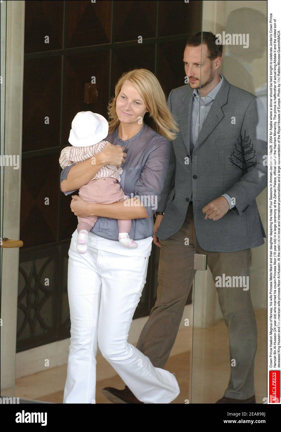Crown Prince Haakon Magnus of Norway, his wife Princess Mette-Marit and their daughter departing the hotel Four Seasons in Amman-Jordan on May28, 2004 for Aqaba where a dinner should be held tonight to celebrate Jordan's Crown Prince Hamzah Bin Al-Hussein (24 year old) who married his cousin Princess Noor (19 year old) in a large ceremony at the Zahran Palace, official seat of the Hachem Monarchy. The prince is halfbrother of actual king Abdala II and the oldest son of deceased King Hussein and his american wife princess Noor Al-Hussein. At the celebration local and international personalities Stock Photo
