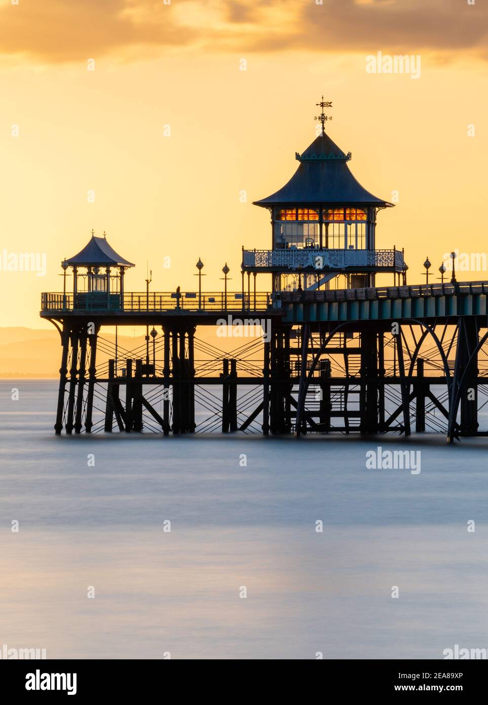 Clevedon Pier beautifully backlit with a golden sunset Stock Photo