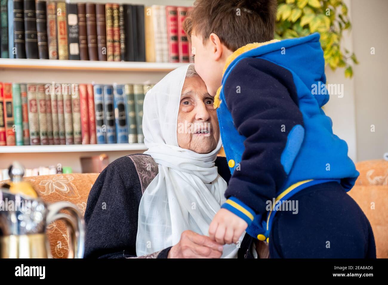Arabic family enjoy eid celebration with grandmother while laughing