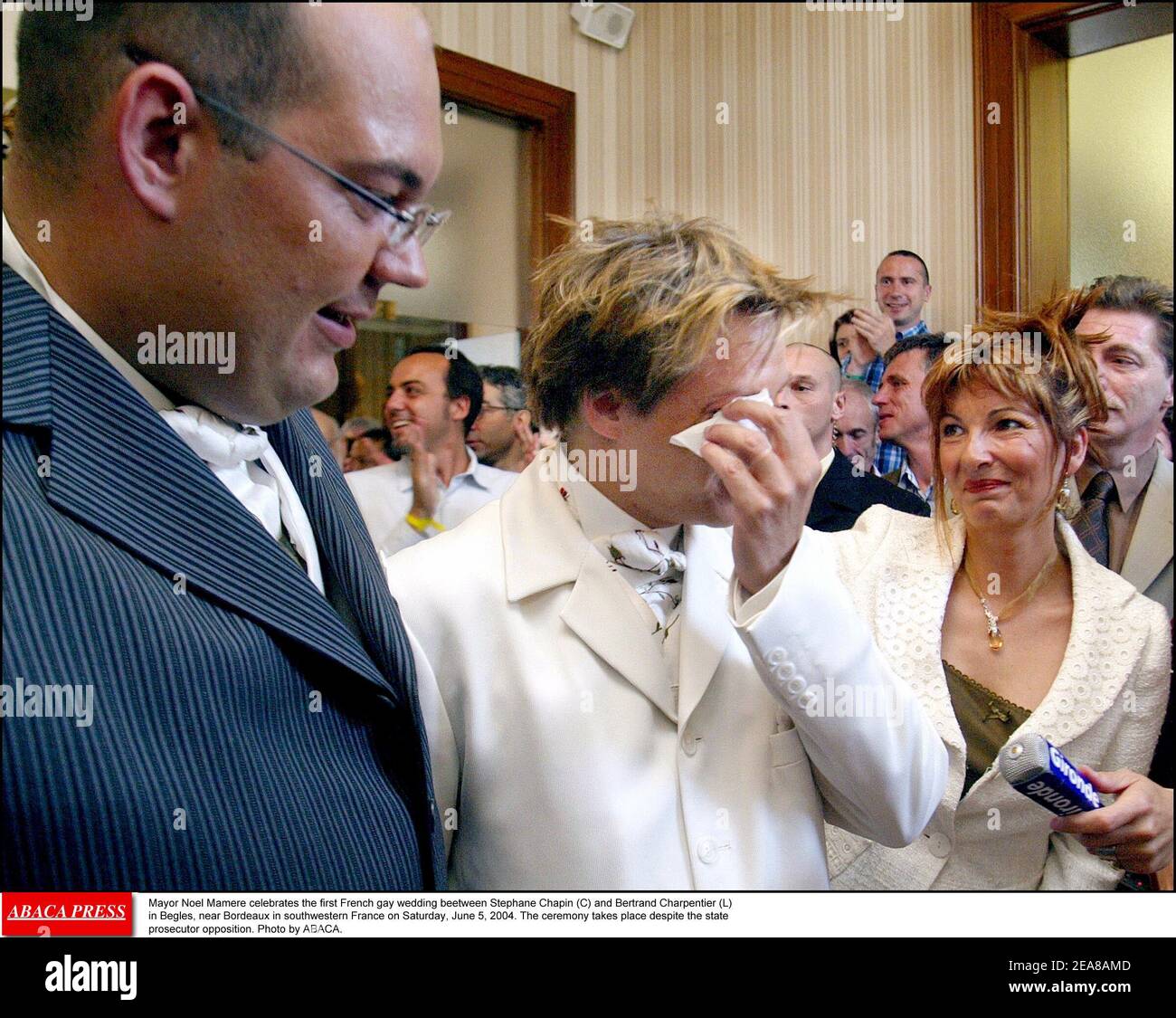 Mayor Noel Mamere celebrates the first French gay wedding beetween Stephane  Chapin (C) and Bertrand Charpentier (L) in Begles, near Bordeaux in  southwestern France on Saturday, June 5, 2004. The ceremony takes