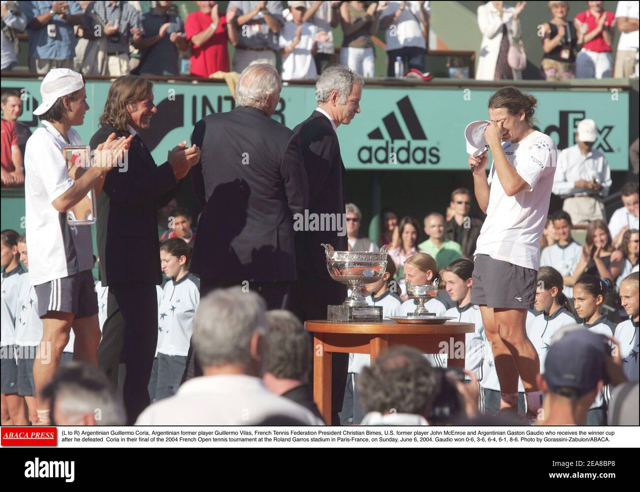 L to R) Argentinian Guillermo Coria, Argentinian former player Guillermo  Vilas, French Tennis Federation President Christian Bimes, U.S. former  player John McEnroe and Argentinian Gaston Gaudio who receives the winner  cup after