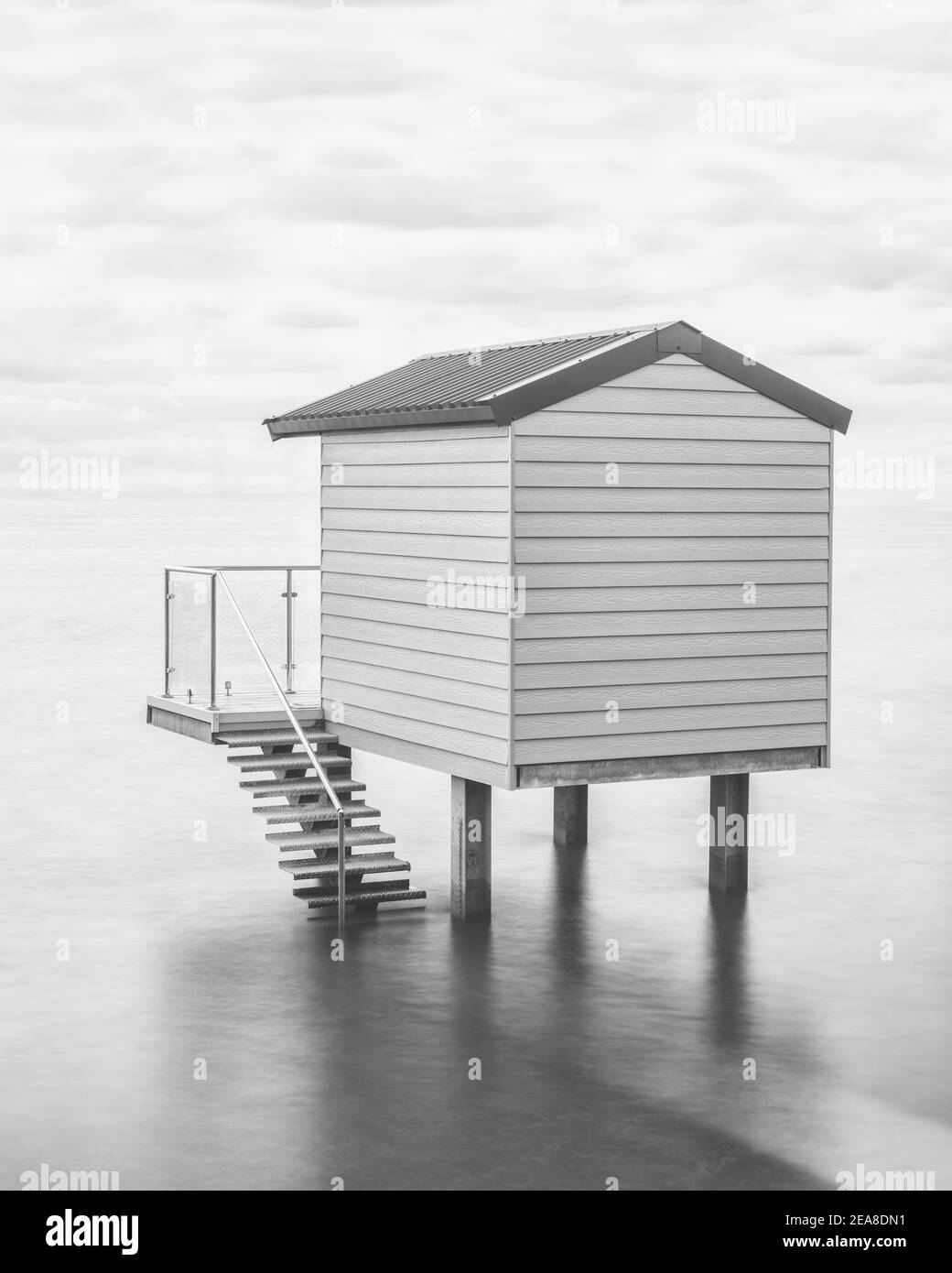 One beach hut up on stilts at high tide at Osea View in Essex Stock Photo