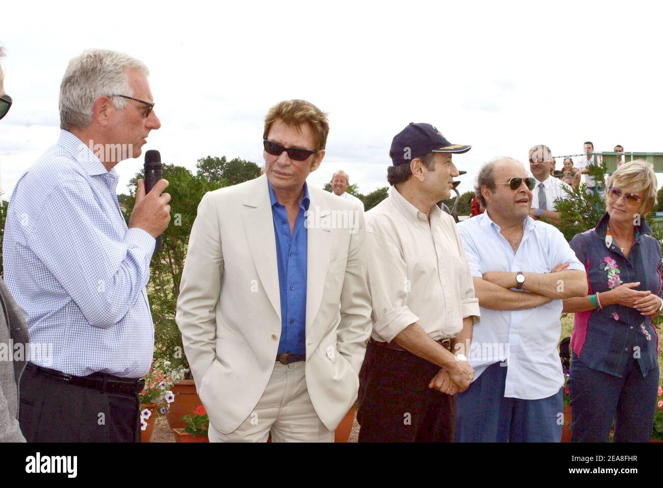 L to R) Mathias moncorge-Gabin, French singer Johnny Hallyday, TV presenter  Michel Drucker, actor Jacques Villeret and former TV presenter Evelyne  Leclerc pictured at the annual charity meeting for the benefit of