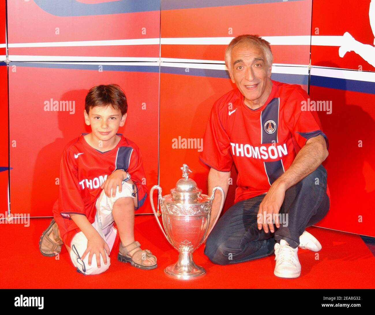 French actor Gerard Darmon and his son pictured at the party for the presentation of the PSG soccer team's new shirt made by sponsor Nike at the Parc des Princes stadium in Paris-France on June 29, 2004. Photo by Bruno Klein/ABACA. Stock Photo